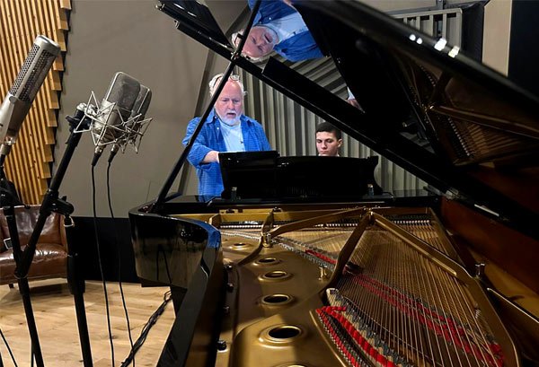 Artist playing a Steinway grand piano at One Soul Studios, Hudson Valley